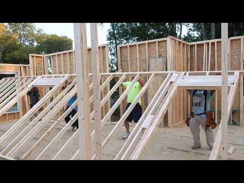 Henry with Carter Rent To Own raising a wall Video