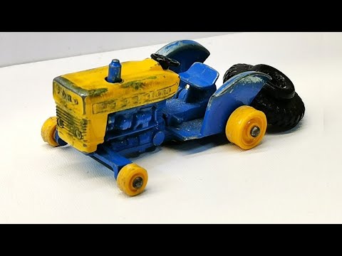 Matchbox-Renovierung des Ford-Traktors Nr. 39. Rekonstruktion von Rädern und Anhängerkupplung.