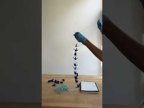 Stringing 1000 paper cranes