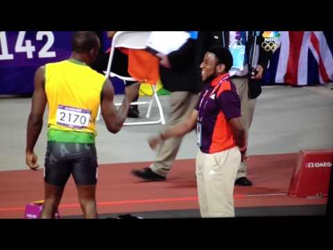 Usain Bolt fist-bumps volunteer