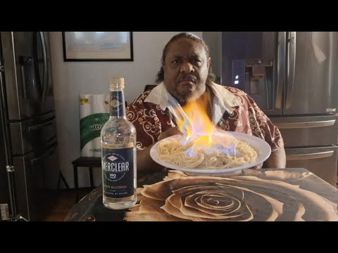 Setting my spaghetti on fire with EVERCLEAR to melt the cheese. Damn that tastes good 