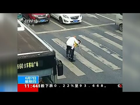 Your friend and helper: Policeman carries man piggyback