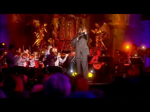 Finale tableau: soloists front, choir behind, hands lifted on the last cadence of Hallelujah Broadway