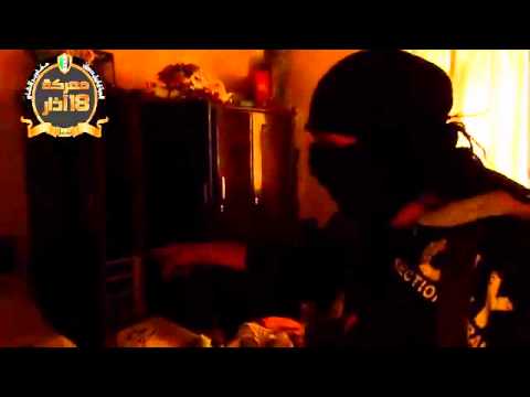 تمشيط المباني بعد السيطرة عليها عند ثكنة سيدي مقداد من قبل سرايا الحسن والحسين