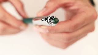 قلم دهنج فضي و أخضر بحجر أخضر 69