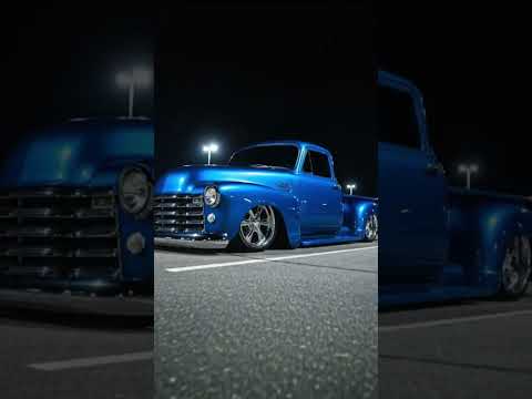 1953 Chevy pickup truck on bags and painted candy blue
