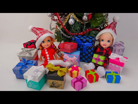 Elsa and Anna toddlers open their Christmas presents