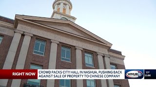 Crowd packs City Hall in Nashua, pushing back against sale of property to Chinese company