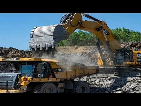 Caterpillar 6015B Excavator Loading Caterpillar Dumpers.