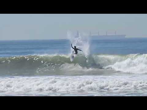 Beach view of nice surfing at HB Pier Southside