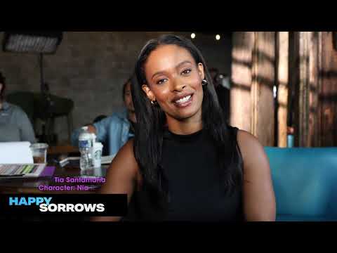 Happy Sorrows Director chair interview with lead actress Tia Santamaria on set.