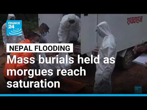 Mass burials held in Nepal as bodies wash up after catastrophic flooding