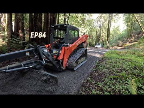 Grading a private driveway. Filling ruts, sloping for drainage and spreading new base rock. EP84