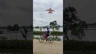 Download lagu DONGO FLYING KITES RIDING A BICYCLE mp3