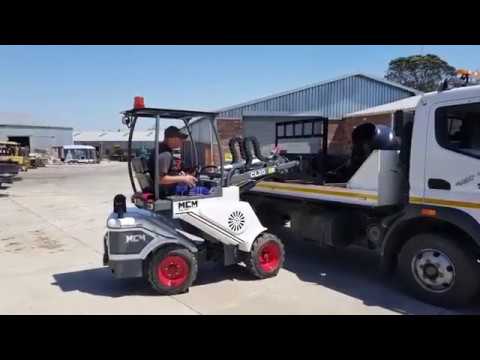 MCM Compact Loaders busy loading Attachments for customers