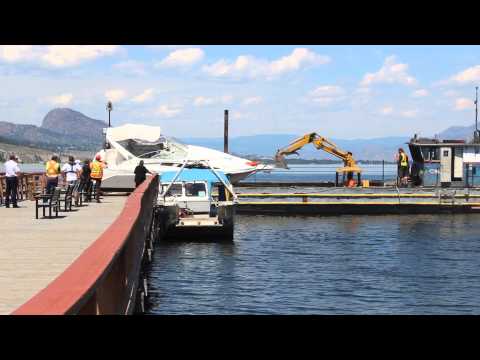 PENTICTON - Crashed boat is hauled away by barge