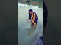 INDIAN GIRL WASHING HER CLOTH IN LAKE