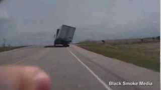 An 18-wheeler nearly flipped over in 50-mile-per-hour winds on a Kansas highway