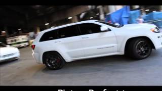 Tip ( T.I.) flexin in the new jeep with OMG girls in the porshe