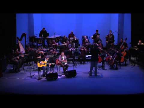 Ella lo mira y se va. canción de Mexicanto Sinfónico en el Aula Magna de la UANL