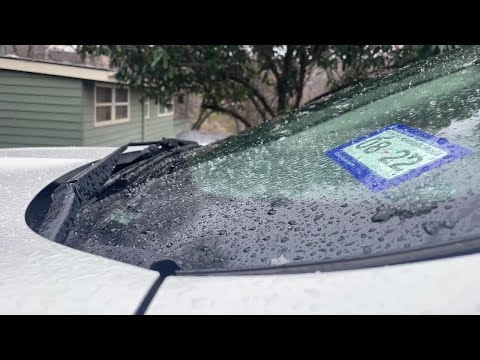 WATCH: Sleet falls lightly on car windshield in Austin