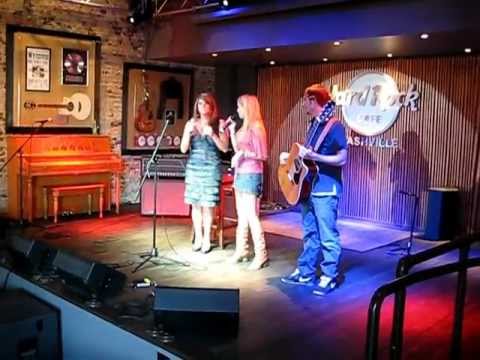 Raven Bro and Ashley Rae singing Happy Birthday to Lisa Asbury at Hard Rock during SSE Showcase