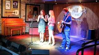 Raven Bro and Ashley Rae singing Happy Birthday to Lisa Asbury at Hard Rock during SSE Showcase