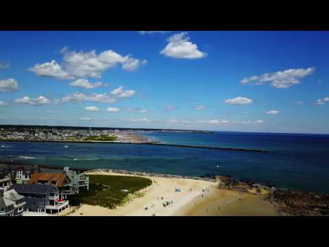 Drone footage of land and sands of Seabrook Beach