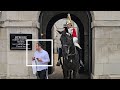 RUDE IDIOT TOURIST STROLLS THROUGH THE BOX. Guard can't believe the stupidity at Horse Guards!