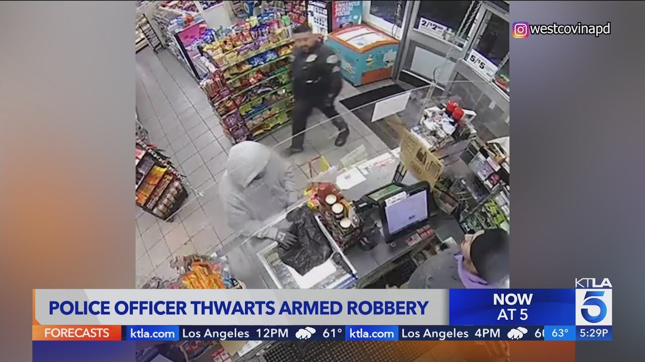 Video captures officer walking into 7-Eleven during armed robbery
