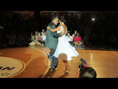  Juana Sepulveda  and  Mariano Frumboli  are  dancing  to  the  tango  "  El Tigre Millan  "  at  A los amigos tango festival  in  2019