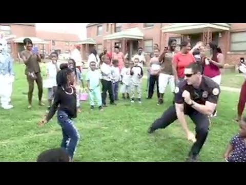Watch Police Office Challenge Residents To Dance-Off While On Patrol