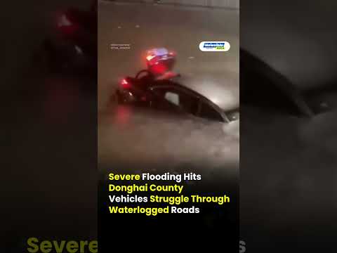 Severe Flooding Hits Donghai County Vehicles Struggle Through Waterlogged Roads