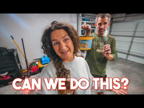 Smiling woman with curly hair and a man in a green shirt hold a yellow bucket toward the camera in a garage, with the bold caption 'CAN WE DO THIS?'
