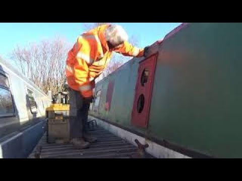 Narrowboat Build & Fit Out. Installing high security side hatch with twin portholes.