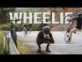Learning to WHEELIE with No Experience