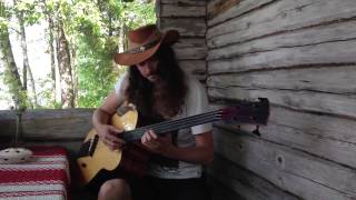 Lauri Porra plays Brian Eno on acoustic bass guitar by the lake