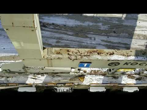 Narvik Norway industrial shipping port with huge cargo lift crane and train yard from Viking Sky