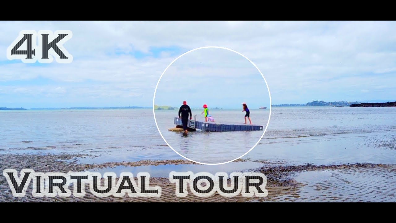 Stroll along the scenic coastal walkway of Cheltenham beach Auckland