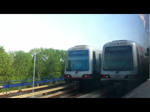 RET Metrorit over linkerspoor langs Waalhaven van Rhoon naar Slinge in Rotterdam