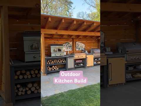 The outdoor kitchen we built during our backyard #renovation. Has #pizzaoven, flat top, and grill.