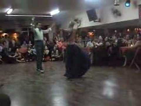  Roberto Herrera  and  Tamara Bisceglia  are  dancing  to  a  chacarera
