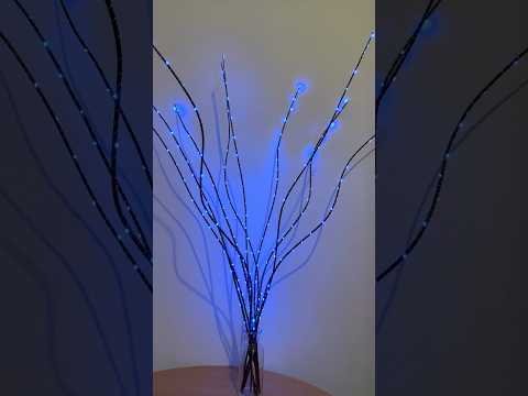 Декоративна лоза чорна з прикрасою у вигляді гірлянди синього кольору