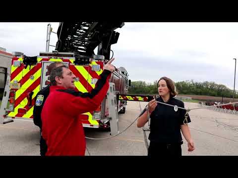 Fire trucks hanging the flag