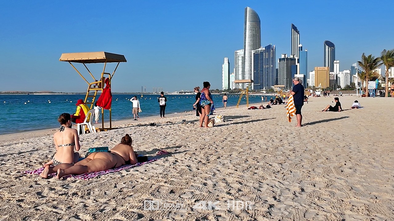 Immersive street-level walking tour through Abu Dhabi Corniche, United Arab Emirates, showcasing authentic urban landscapes, local architecture, and the vibrant atmosphere of the city's neighborhoods