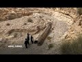 Jewish Ultra-Orthodox families inspect debris of whats believed to be an intercepted Iranian surfac - Video