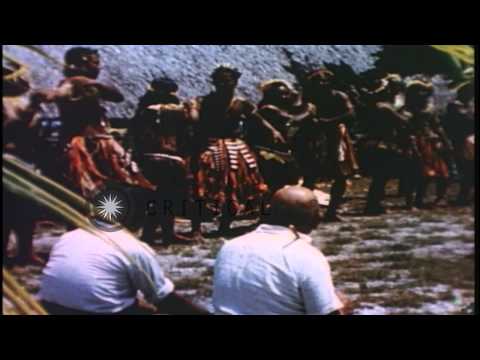 Pacific islanders dance, repair fish nets, and sail boats while being photographe...HD Stock Footage