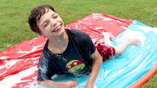 SLIPPING AND SLIDING/ BACK YARD FUN!!
