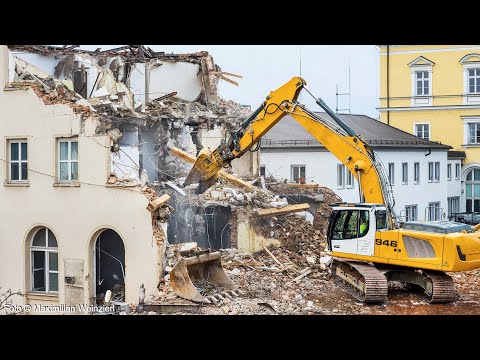 an iron dinosaur gnaws at the building. demolition and changes in the familiar cityscape. Regensburg