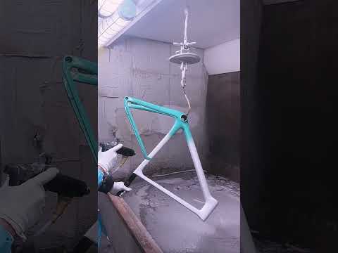 Applying clear varnish to a Graro white-to-blue gradient frame.#icancycling #graro